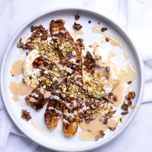 Image of Caramelized Banana with Pistachio Brown Butter Granola, Labneh and Tahini