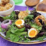Almond-Crusted Eggs on a  Sage Flower Herb Salad