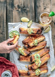 Pulled pork taquitos with avocado crema