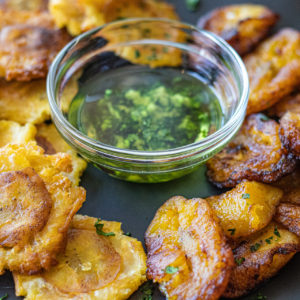 Traditional Dominican Green and Yellow Fried Plantains with Mojo Sauce