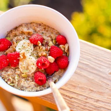 High Protein Vegan Oatmeal With Banana and Raspberries