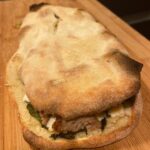 Panuozzo napoletano with sausage and broccoli rabe