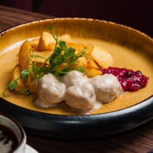 Meatballs and Baked Potatoes Topped With Béchamel Sauce