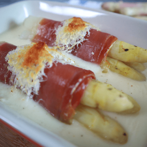 White asparagus wrapped in ham