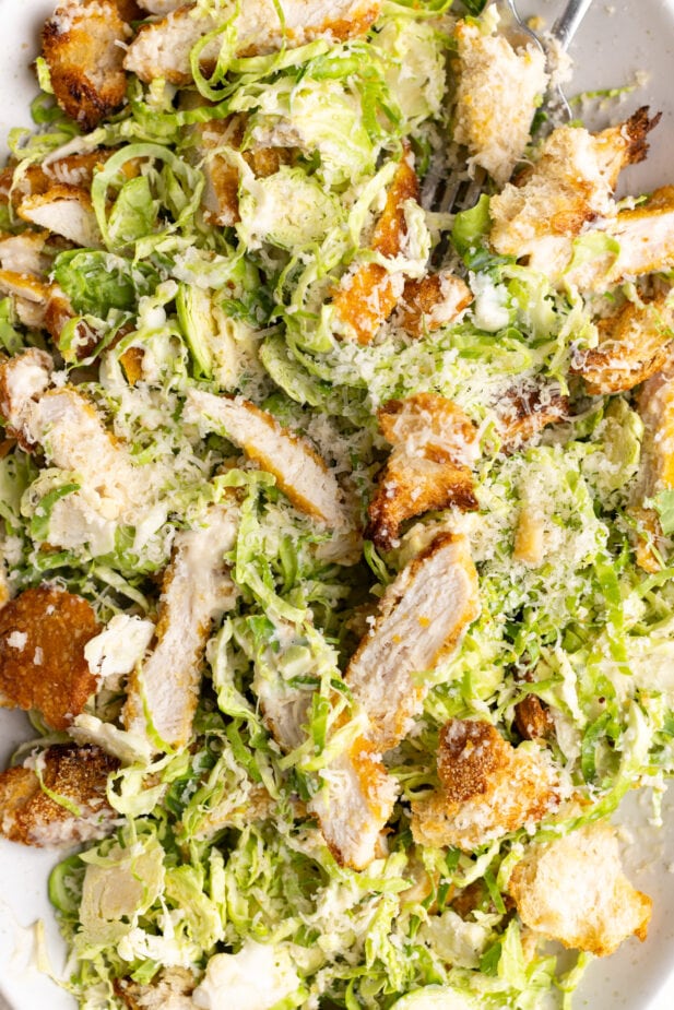 Brussels Sprout Salad with a Roasted Garlic Caesar Dressing