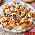 Roasted Sweet Potatoes and Cauliflower with Spicy Tahini Sauce