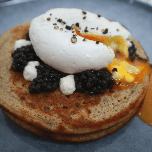 Blinis with poached egg and caviar