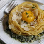 Fried Egg Spaghetti Nests Over Creamed Spinach